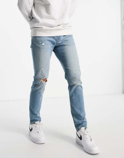 ASOS DESIGN skinny jeans in tinted light wash with abrasions