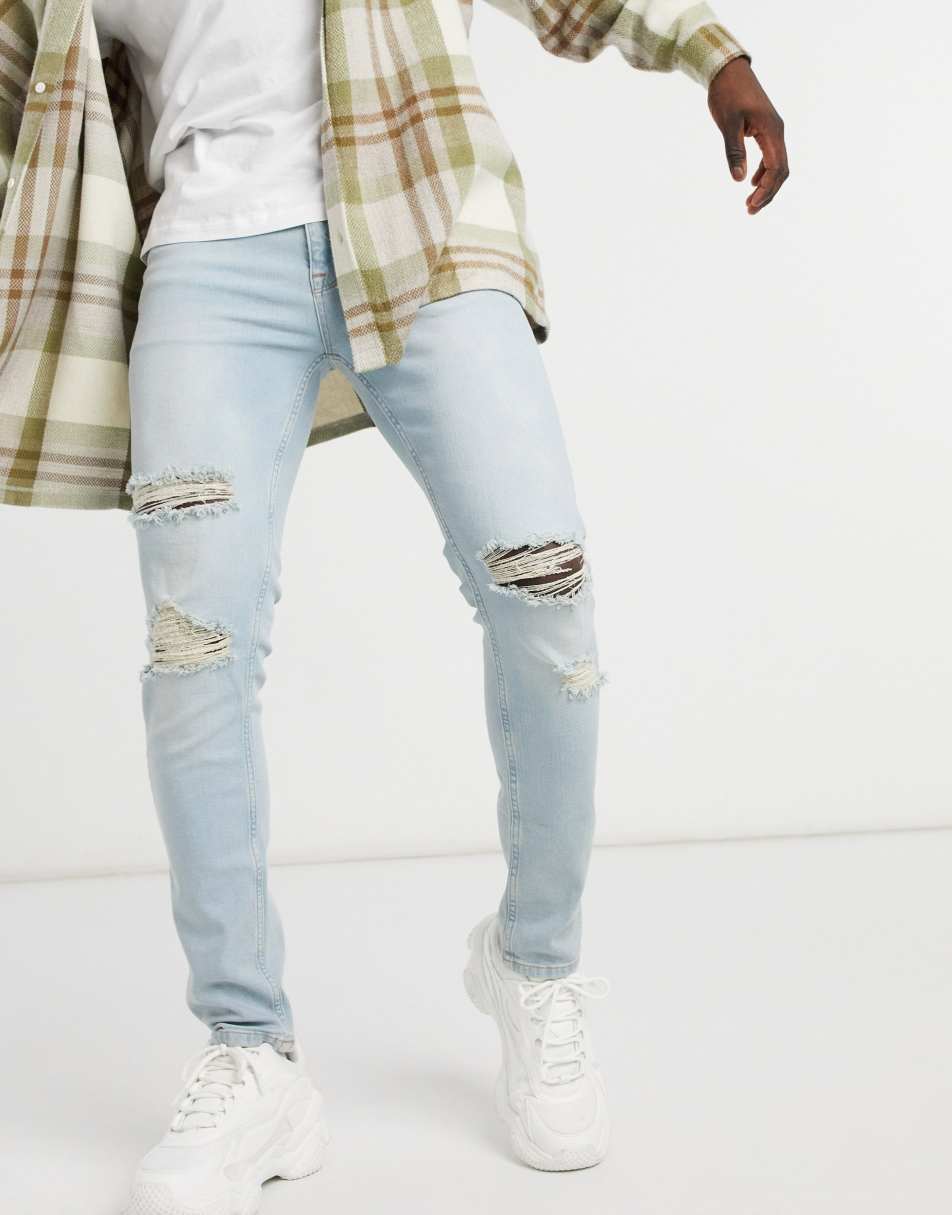 ASOS DESIGN skinny jeans in vintage light wash with rips