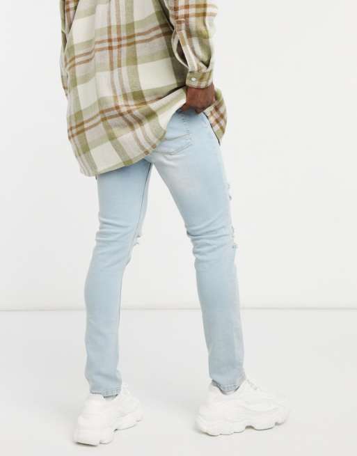 ASOS DESIGN skinny jeans in vintage light wash with rips, 2 of 4