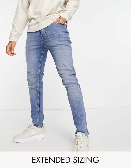 ASOS DESIGN super skinny jeans in mid wash blue with abrasions