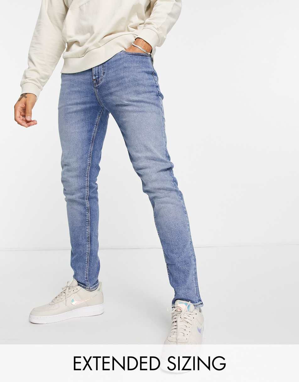 ASOS DESIGN skinny jeans in vintage mid wash blue