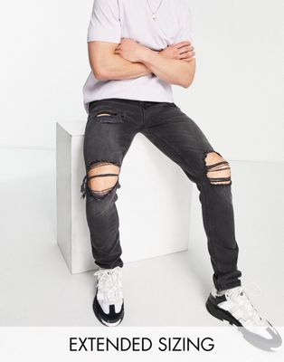 ASOS DESIGN skinny jeans in washed black with all over rips  - ASOS Price Checker