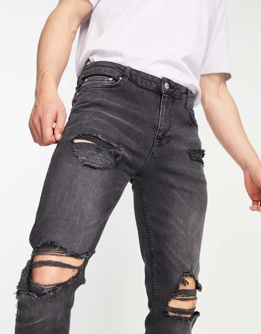 ASOS DESIGN skinny jeans in washed black with all over rips | ASOS