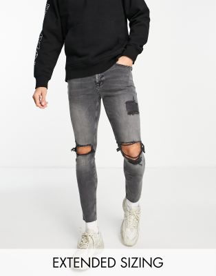 FhyzicsShops DESIGN skinny jeans in washed black with heavy rips