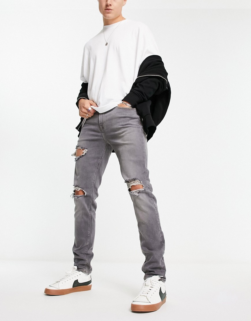 ASOS DESIGN skinny jeans in washed gray with heavy rips-Grey