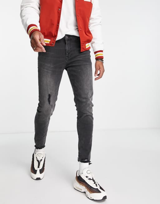 ASOS DESIGN - Skinny jeans in zwart met onafgewerkte zoom 