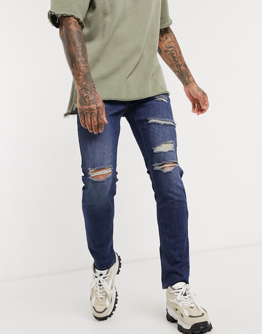 ASOS DESIGN – Skinny jeans med slitningar i mörkblå tvätt