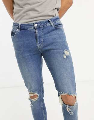 ASOS DESIGN - Skinny jeans met scheuren in dirty mid wash blue | ASOS