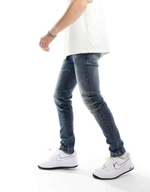ASOS DESIGN skinny jeans with abrasions in dark wash blue, 3 of 5