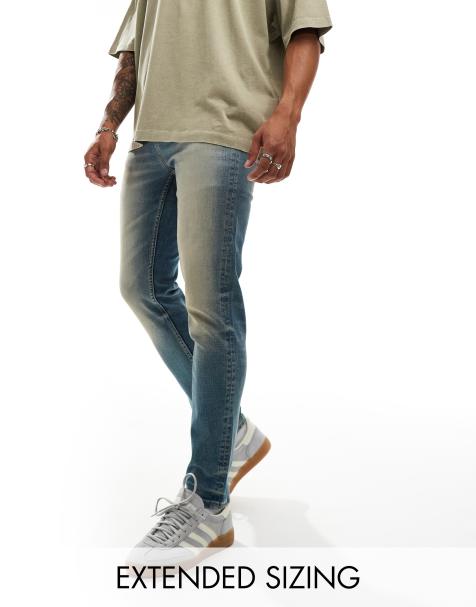 ASOS DESIGN skinny jeans with extreme tint in mid wash blue - view 1