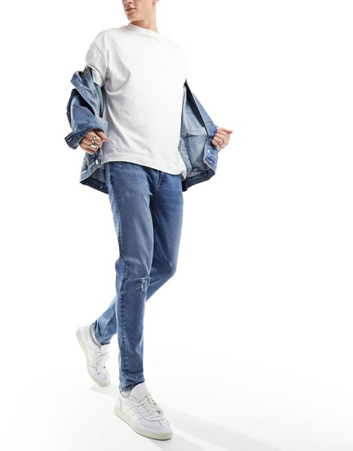 FhyzicsShops DESIGN skinny jeans with knee rip in dark wash blue