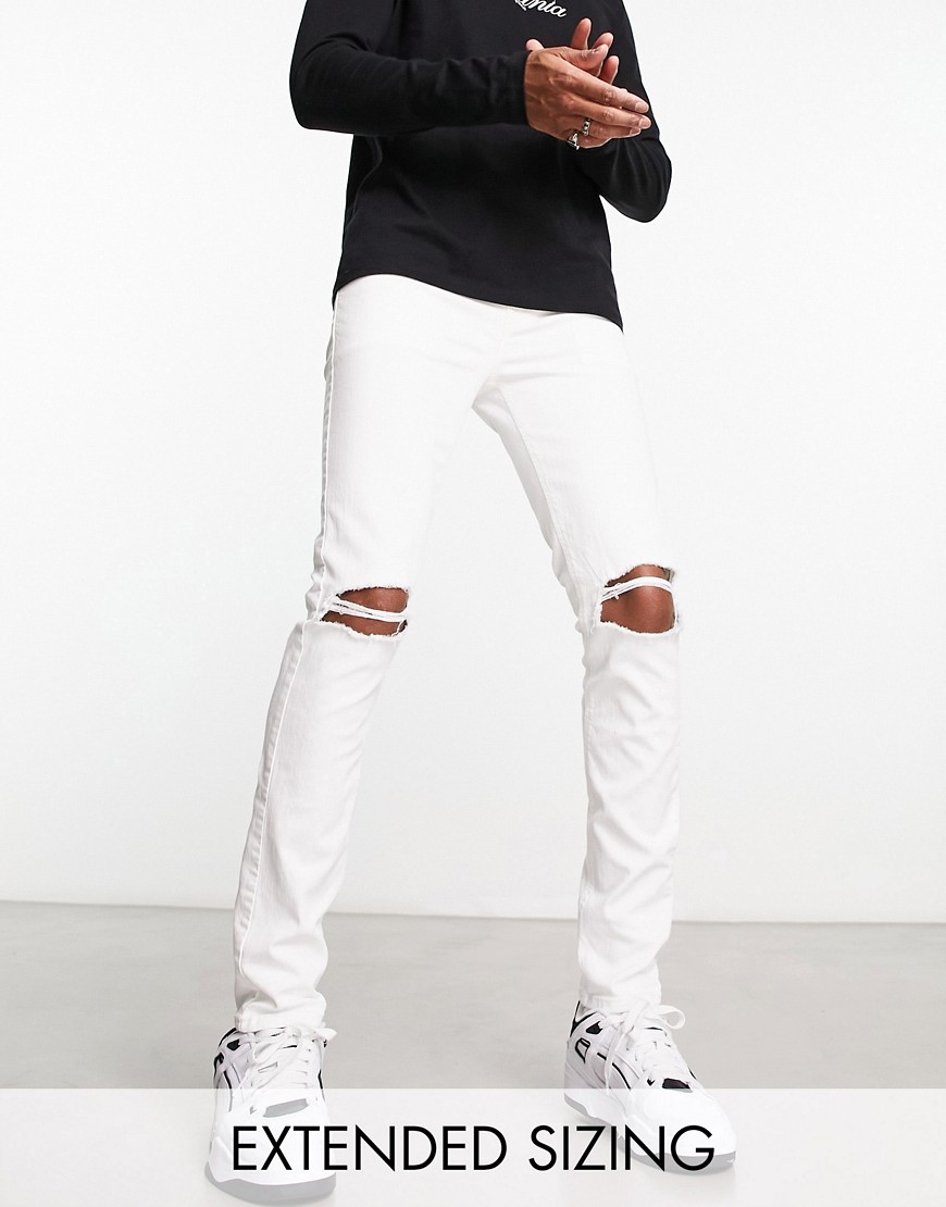 ASOS DESIGN skinny jeans with knee rips in white
