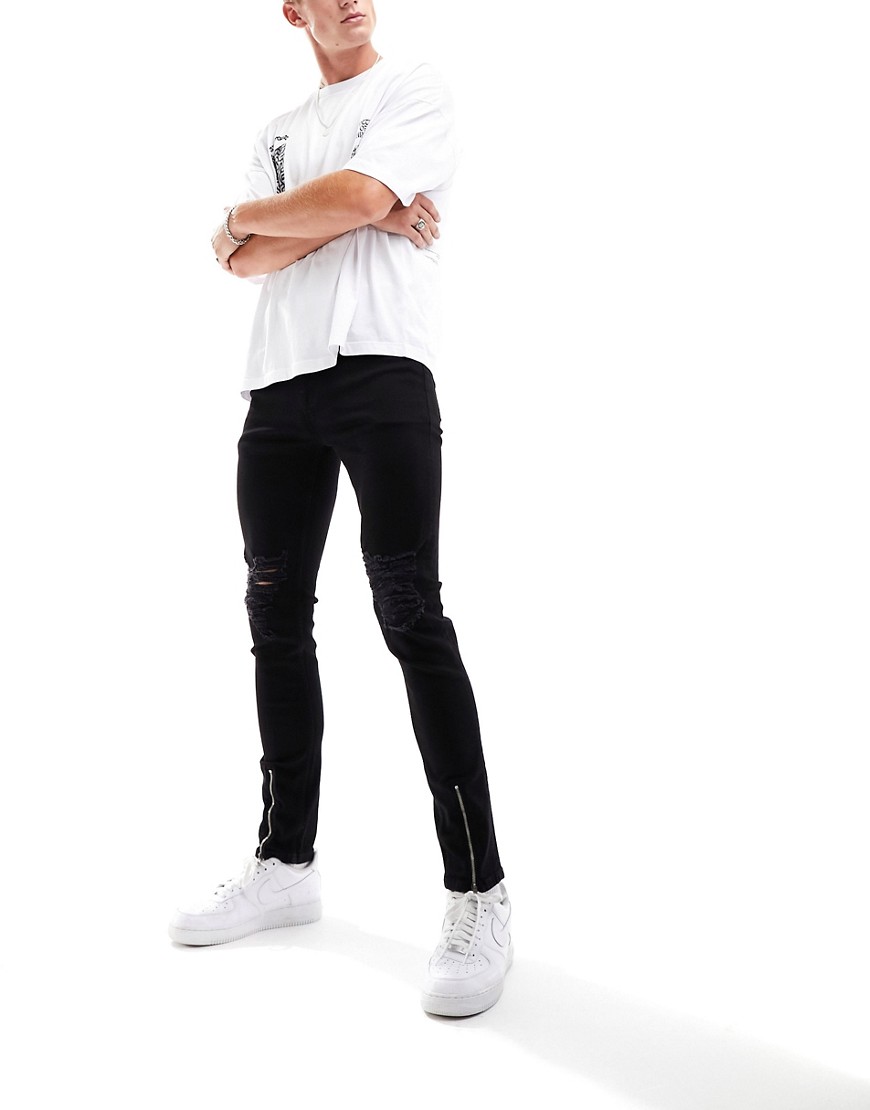 ASOS DESIGN skinny jeans with rips in black