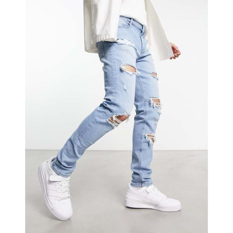 ASOS DESIGN skinny jeans with rips in light wash blue