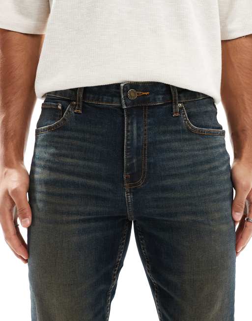 ASOS DESIGN skinny jeans with tint in dark wash blue, 5 of 5