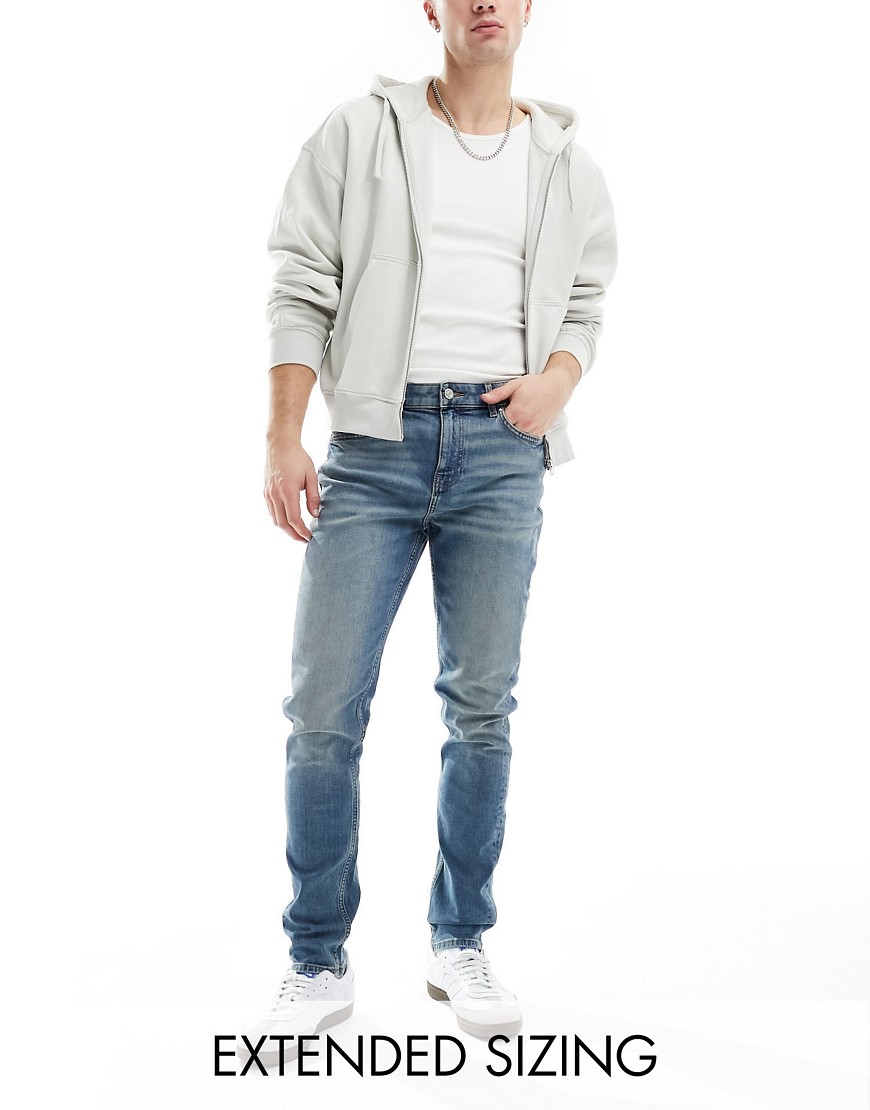 skinny jeans with tint in light wash blue