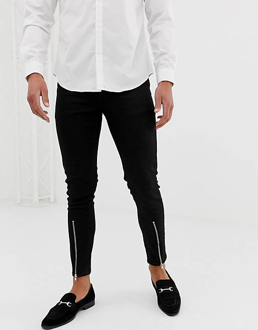 ASOS DESIGN skinny jeans with zipped hem detail in black | ASOS