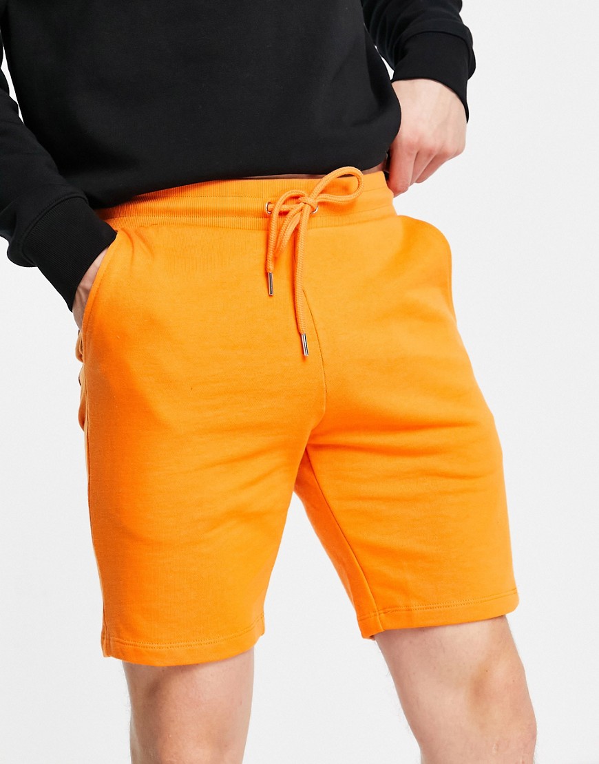 ASOS DESIGN skinny jersey shorts in bright orange