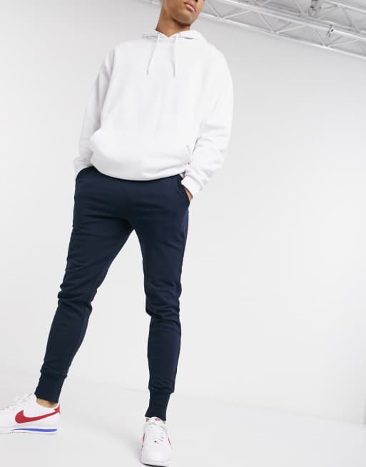 ASOS DESIGN skinny joggers in navy with deep rib cuff