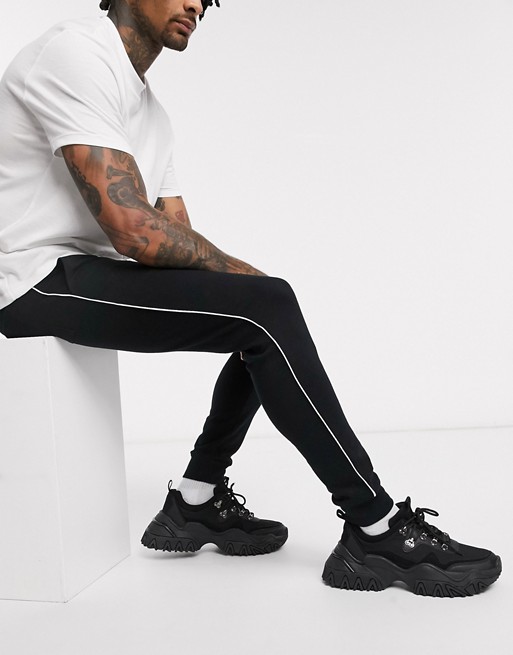 ASOS DESIGN skinny joggers with piping in black