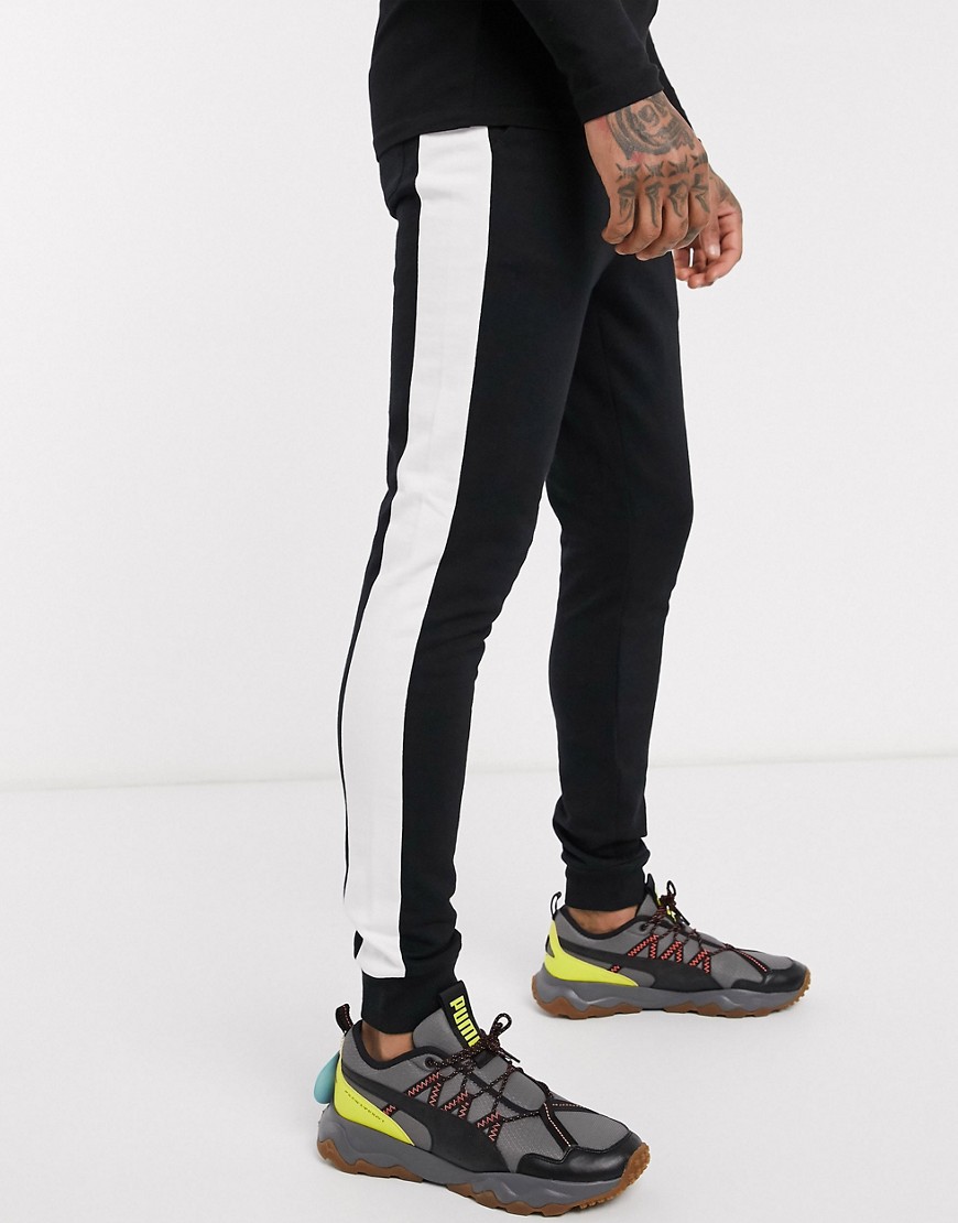 ASOS DESIGN skinny joggers with side stripe in black
