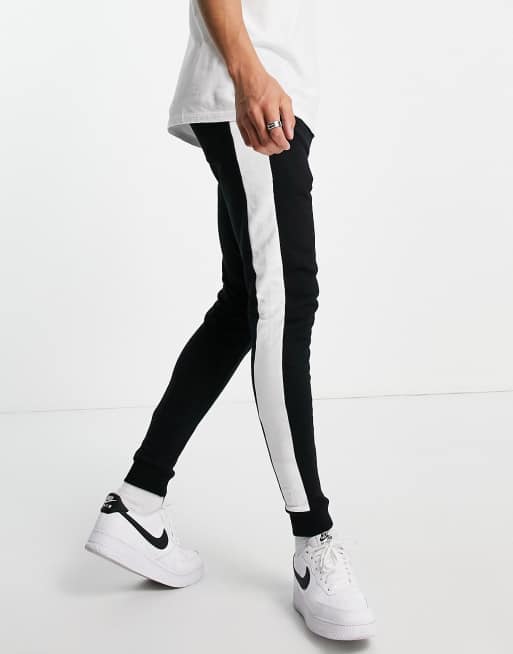 ASOS DESIGN skinny joggers with side stripe in black ASOS