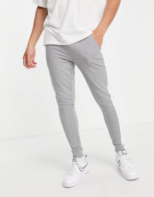 Asos design skinny joggers with store side stripe