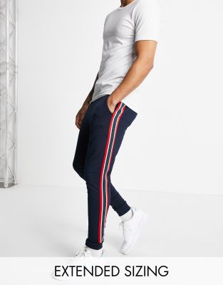 ASOS DESIGN skinny joggers with side stripe in navy