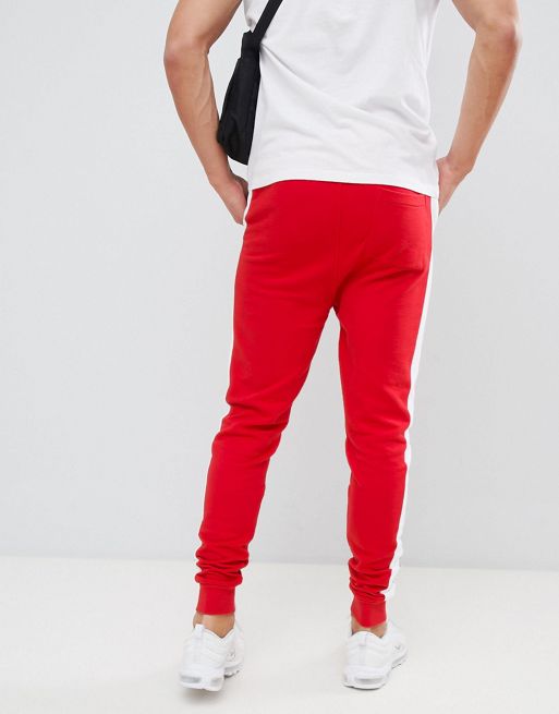 Men's red joggers with side stripe