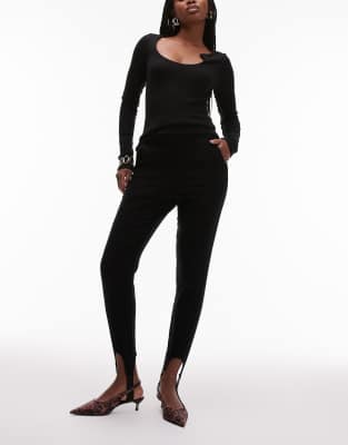 skinny leg stirrup pants in black-Red