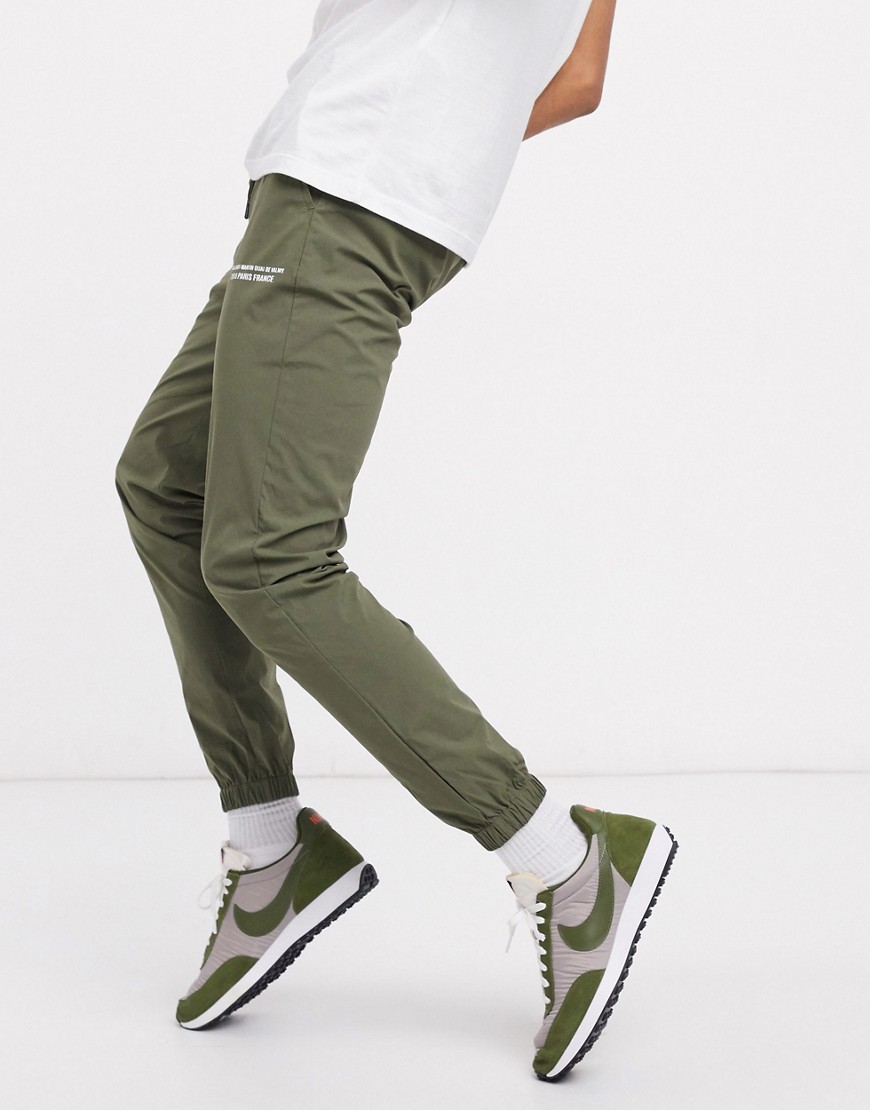 ASOS DESIGN skinny nylon pants with city print text print-Green