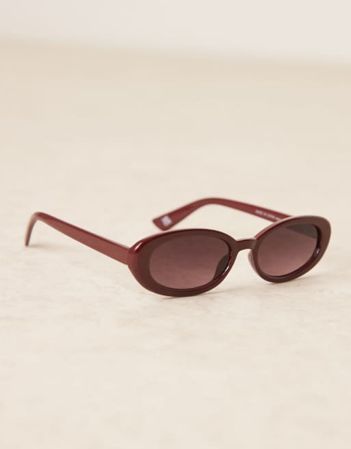 ASOS DESIGN skinny oval sunglasses in burgundy | ASOS display picture 1