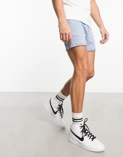 ASOS DESIGN skinny shorter length denim shorts in light wash blue