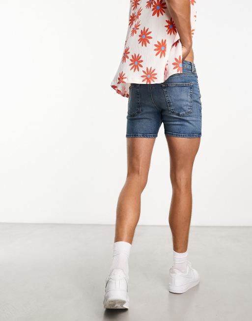 ASOS DESIGN shorter length denim shorts in 90s mid wash with rip detail and  raw hem