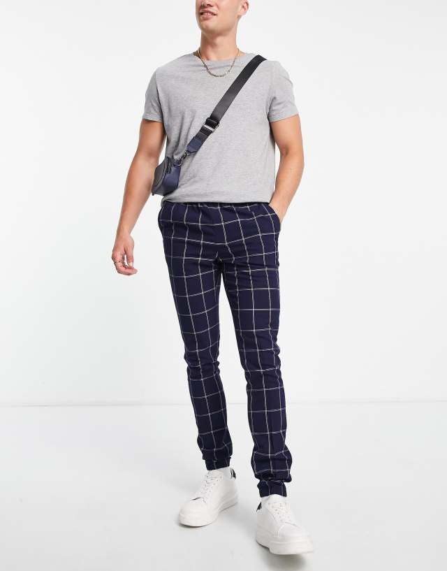 ASOS DESIGN skinny smart sweatpants with window plaid in navy