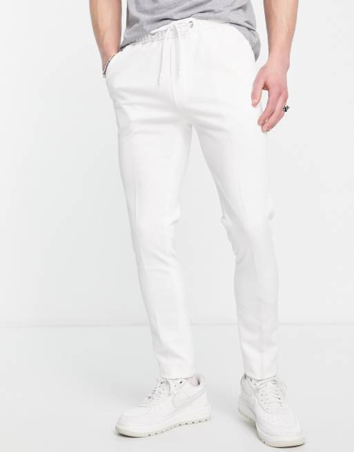 ASOS DESIGN skinny smart trackies in white texture