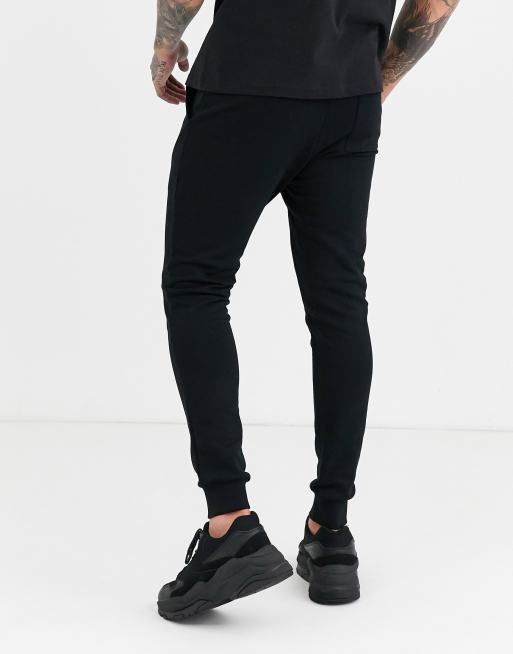 ASOS DESIGN skinny flared sweatpants in ribbed black