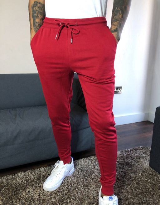 ASOS DESIGN skinny sweatpants in red