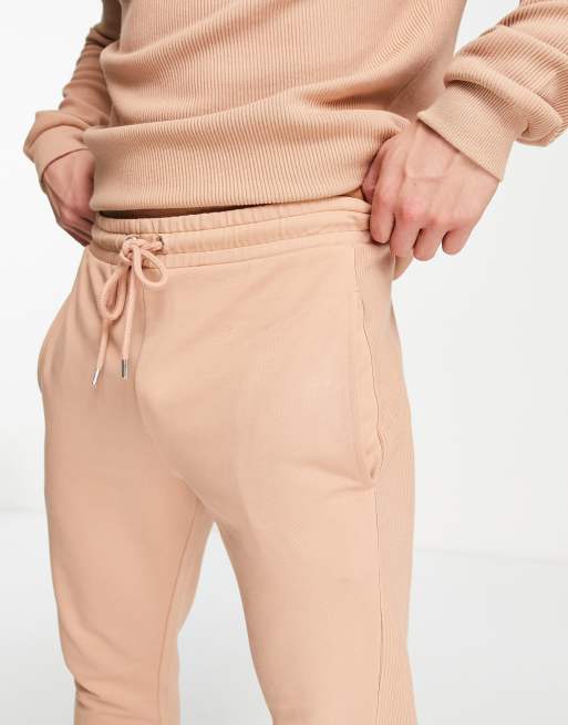 ASOS DESIGN skinny sweatpants with rib side panel in orange - part of a set