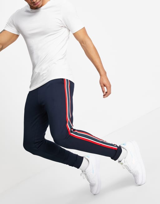 ASOS DESIGN skinny sweatpants with side stripe in navy