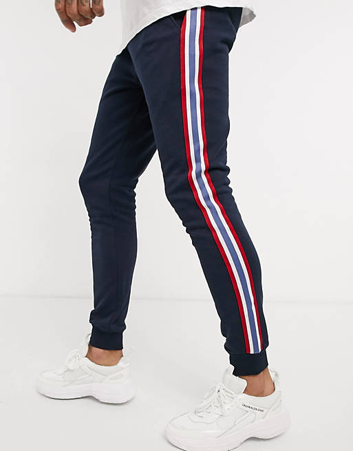 ASOS DESIGN skinny sweatpants with side stripe taping in navy | ASOS