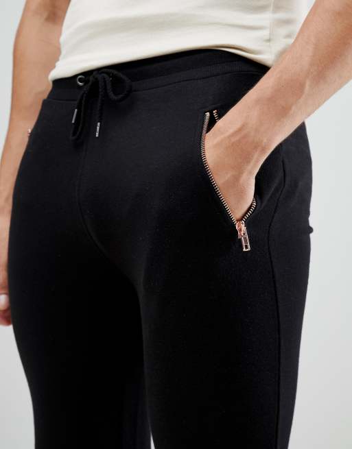 ASOS DESIGN skinny trackies with rose gold ankle zip and pockets, 3 of 4
