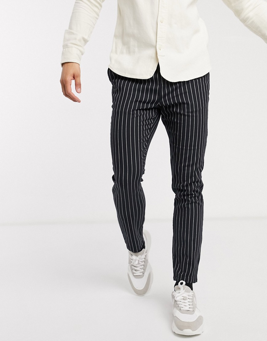 ASOS DESIGN skinny trousers in black pinstripe