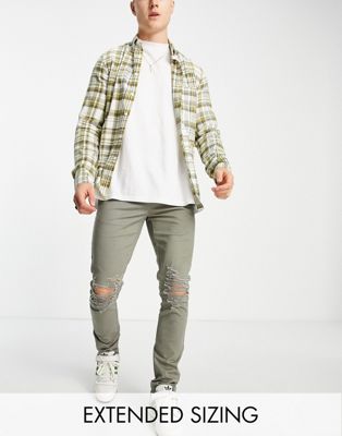 ASOS DESIGN skinny trousers with rips in khaki