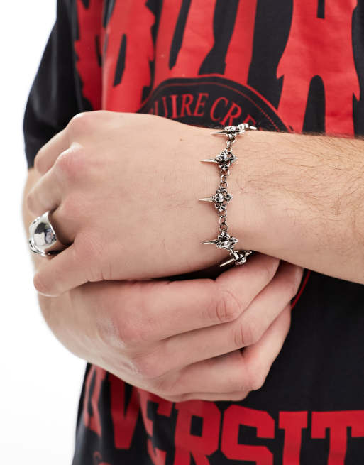 ASOS DESIGN skull dagger charm bracelet in silver tone