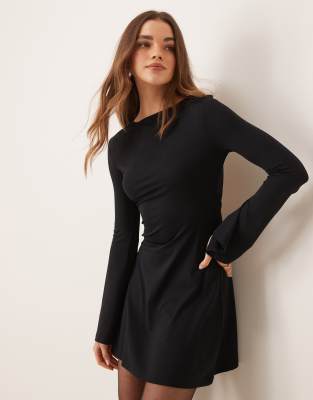 slash neck flute sleeve mini dress with back detail in black