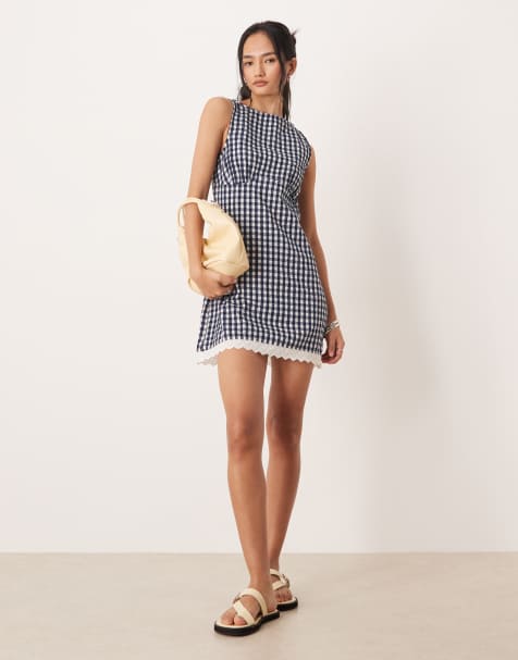 ASOS DESIGN slash neck mini sundress with sculpted bust and broderie hem in navy gingham - view 1