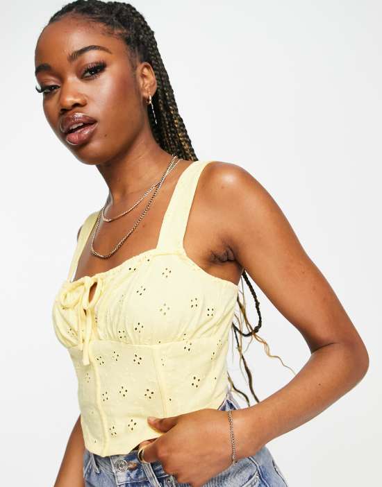 https://images.asos-media.com/products/asos-design-sleeveless-eyelet-corset-top-in-yellow/201477945-3?$n_550w$&wid=550&fit=constrain