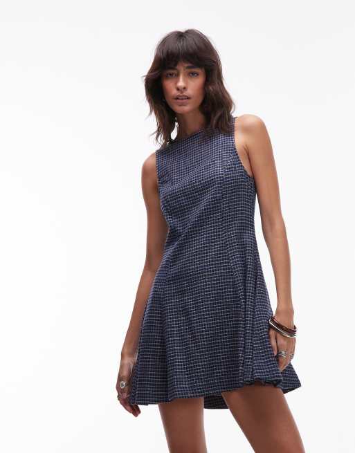 ASOS DESIGN sleeveless mini dress with box pleats in deep navy plaid