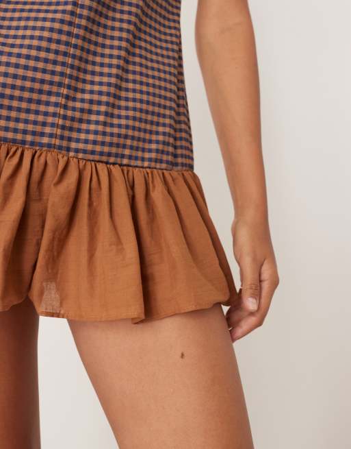 ASOS DESIGN sleeveless mini shift dress with frill hem in brown and navy plaid